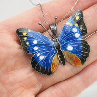 Collier pendentif papillon en émail argenté vintage