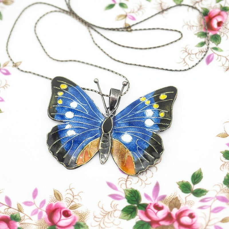 Collier pendentif papillon en émail argenté vintage